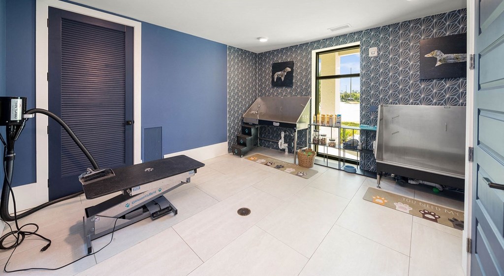 a recording studio with a piano and a television