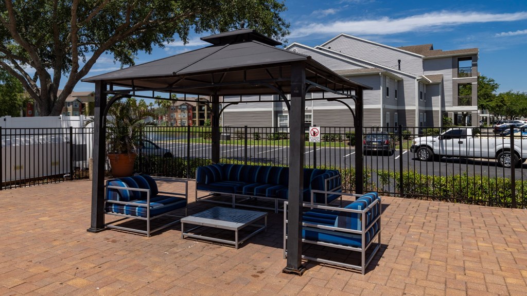 a seating area with benches and stairs in a park