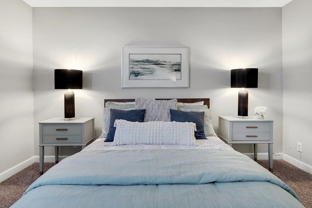 a bedroom with a bed and two night stands at Stonewater Apartments, Louisville, KY 40241