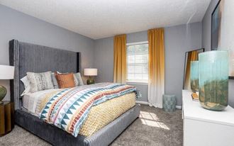 a bedroom with a bed and a large window at Station JTown, Louisville Kentucky - Photo Gallery 5