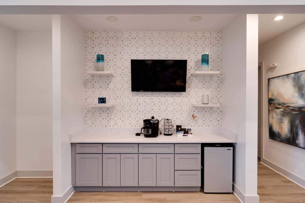 a kitchen with a counter and a tv on the wall at Enclave at Breckenridge Apartments, Louisville, 40220