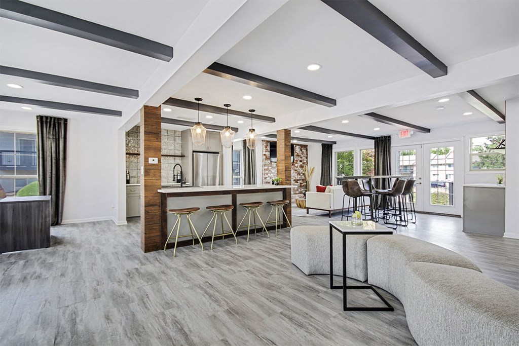 a resident lounge with couches chairs and a table at Southridge, Kansas City, KS, 66103