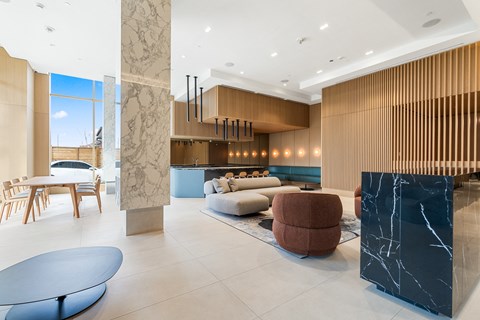 A modern living room with a black marble counter and a brown sofa.