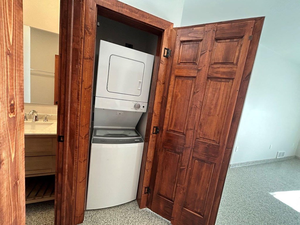 a laundry room with a washer and dryer in it
