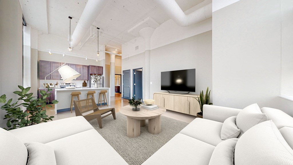 a living room with a white couch and a table