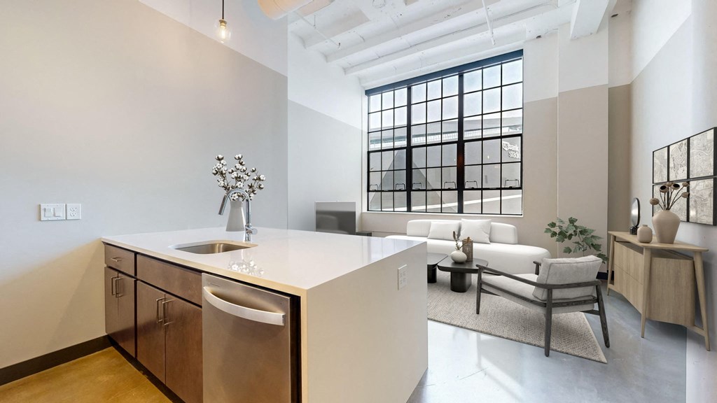 a kitchen and living room with a large window
