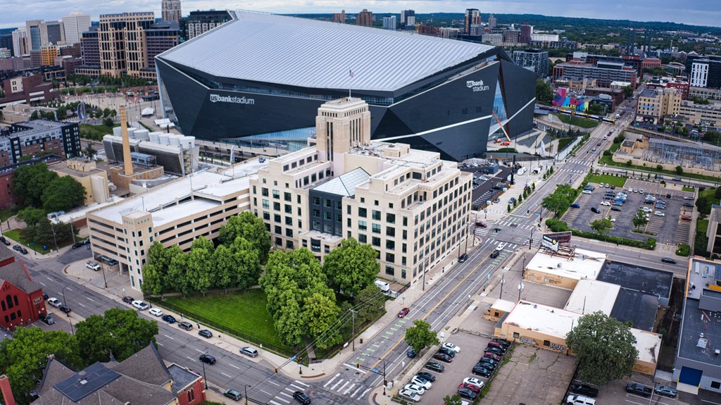 an aerial view of the city with the convention center in the background