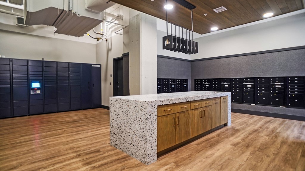 a large room with a counter top in the middle