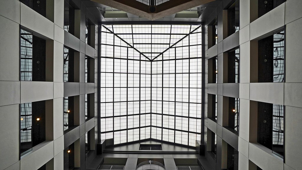a view of arium of a large building with a large window and many windows
