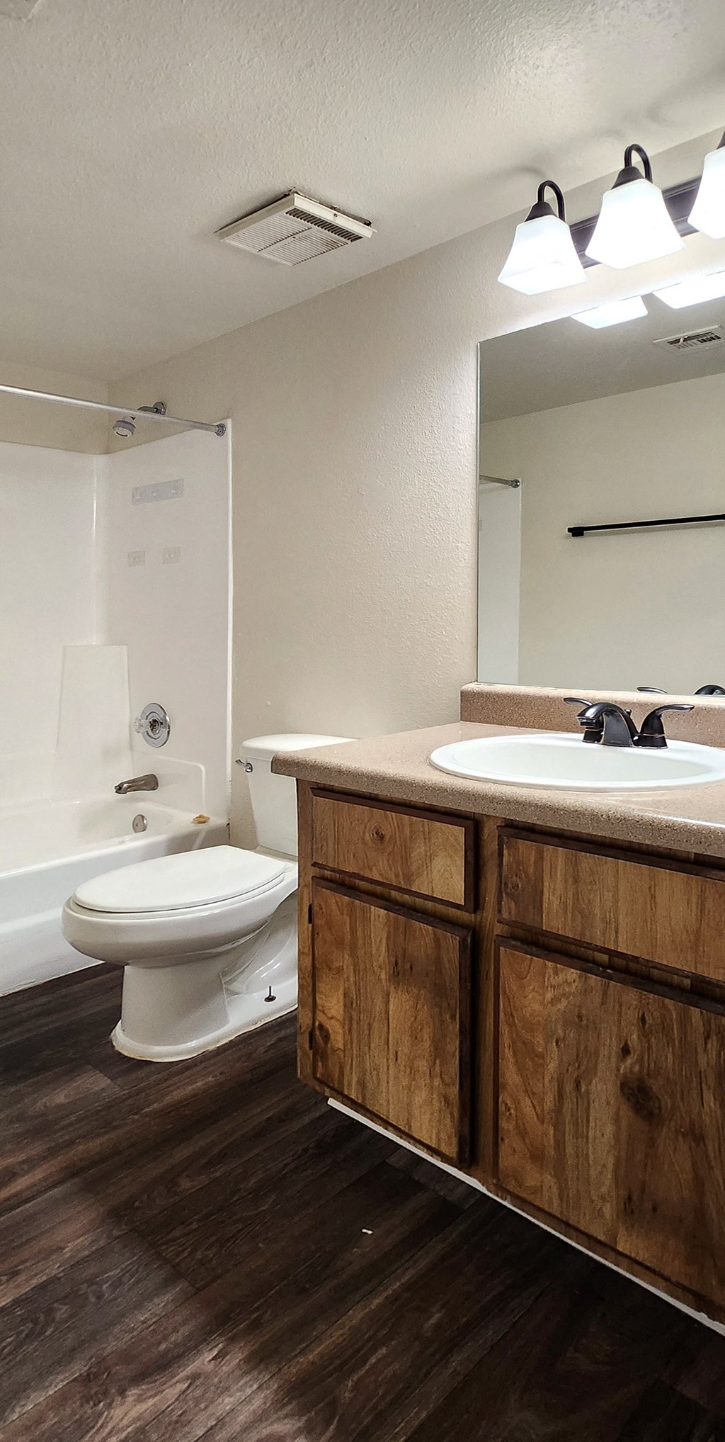 a bathroom with a toilet sink and bathtub