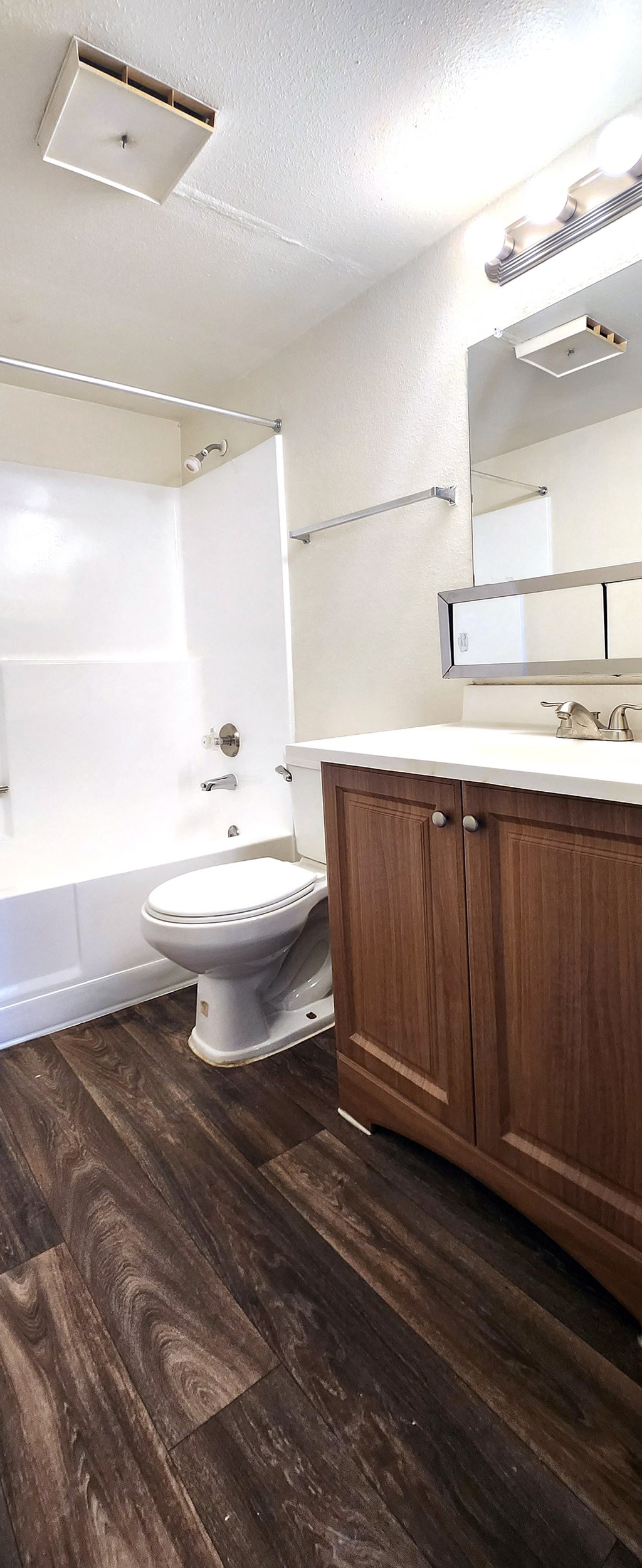a small bathroom with a toilet sink and bathtub