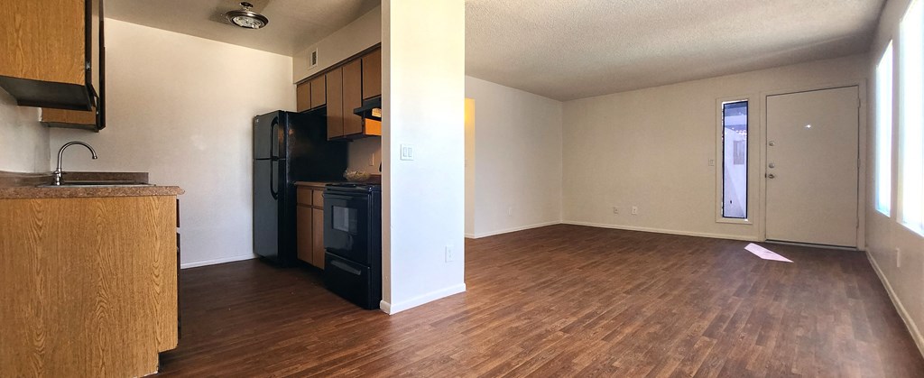 a kitchen and living room in an apartment