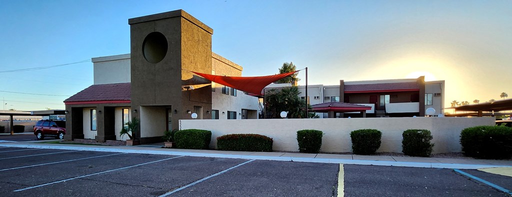 Leasing office with a red awning at sunrise