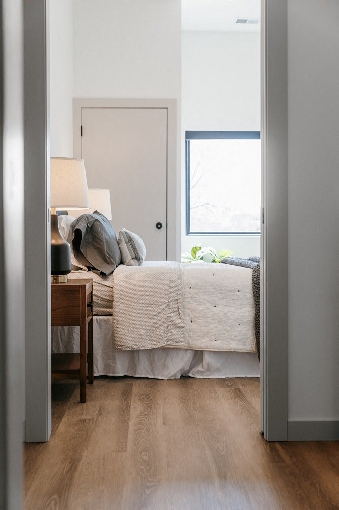 a bedroom with a bed and a window