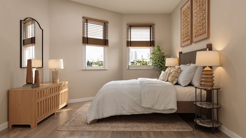A bedroom with a large bed, a wooden nightstand, and a large mirror.