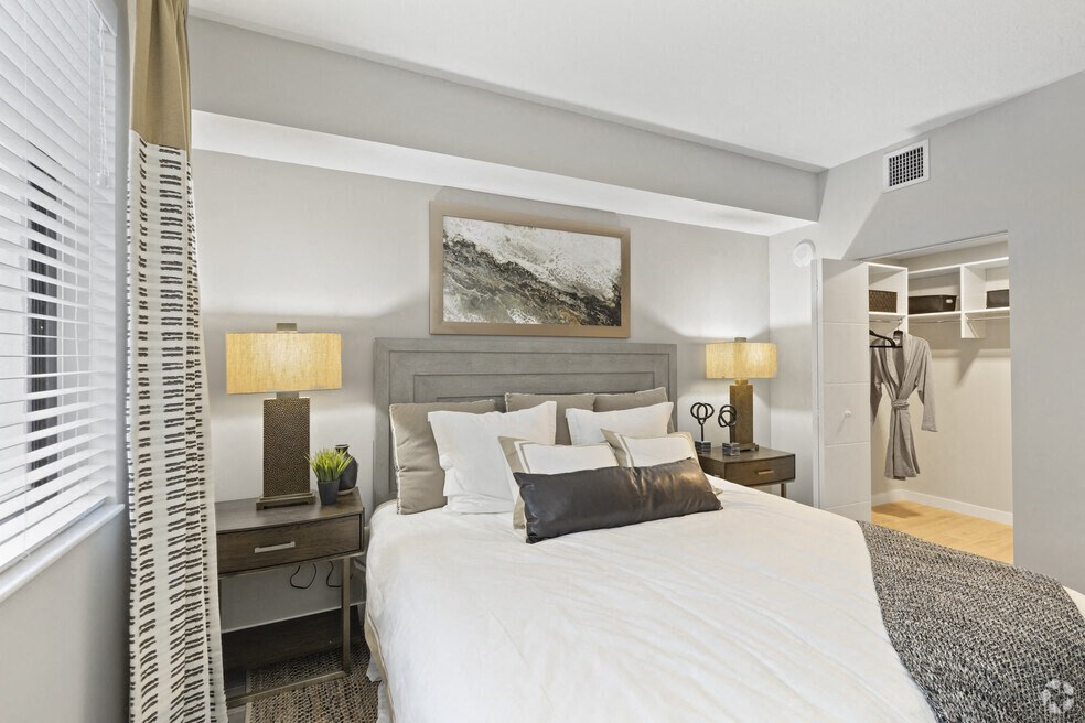 a bedroom with a bed and a closet at Mayla Pompano, Pompano Beach, Florida