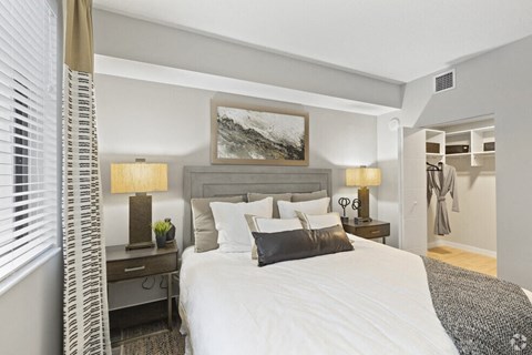 a bedroom with a bed and a closet at Mayla Pompano, Pompano Beach, Florida