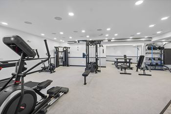 A spacious gym with treadmills, elliptical machines, and weightlifting equipment.at The Reserve La Mirada, La Mirada, 90638