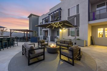 A patio with a fire pit and seating area.at The Reserve La Mirada, La Mirada