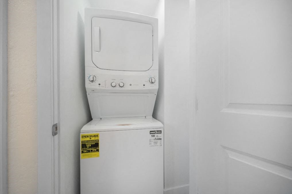 a white washer and dryer in a white room