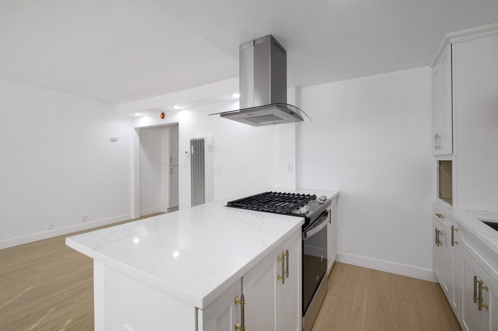 A modern kitchen with a white countertop and stainless steel appliances at Arlington Square Apartment , Torrance, 90501