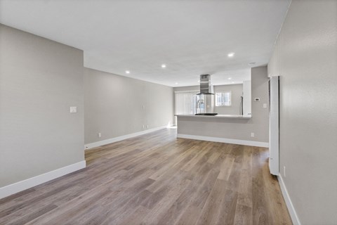 renovated kitchen and living room at Ocean Breeze Terrace Apartment, Huntington Beach, CA