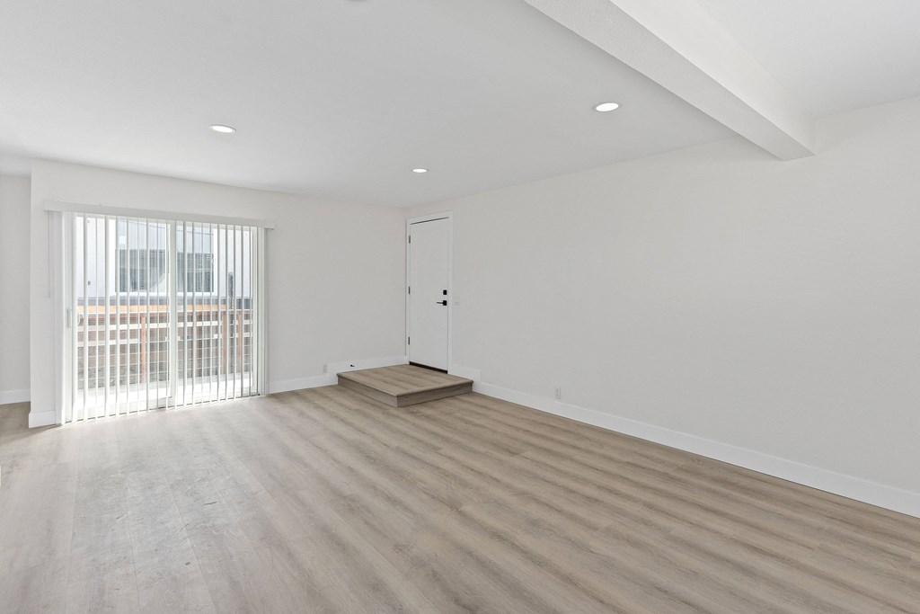 a bedroom with hardwood floors and white walls at Seaview Terrace Apartment Homes, San Clemente, CA, 92672