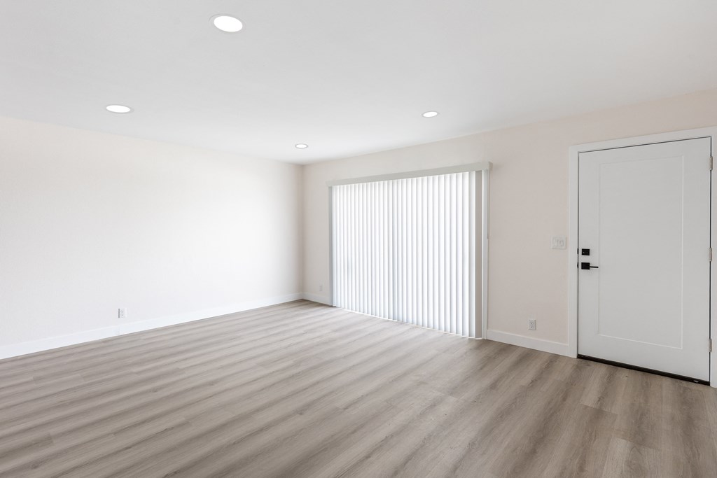 a bedroom with hardwood floors and white walls at Seaview Terrace Apartment Homes, San Clemente, CA, 92672