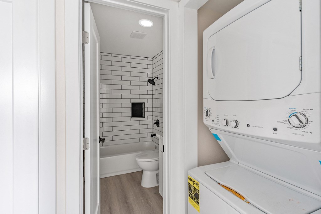 a washer and dryer in a bathroom at Seaview Terrace Apartment Homes, California