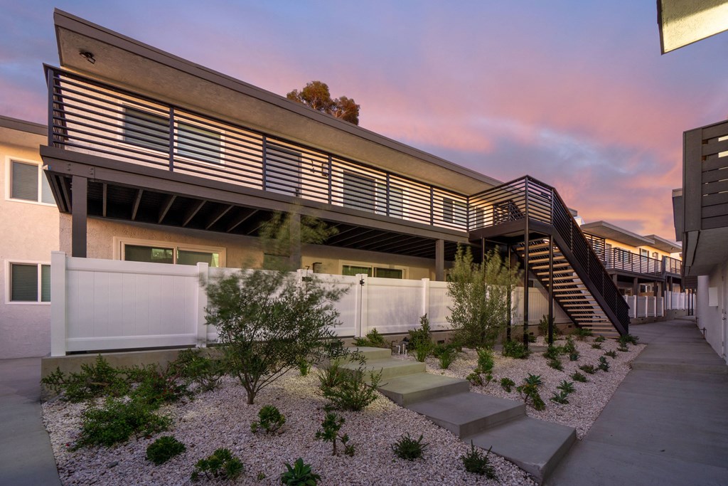 a view of the exterior of a building with a stairway leading up to the second floor at Seaview Terrace Apartment Homes, California, 92672