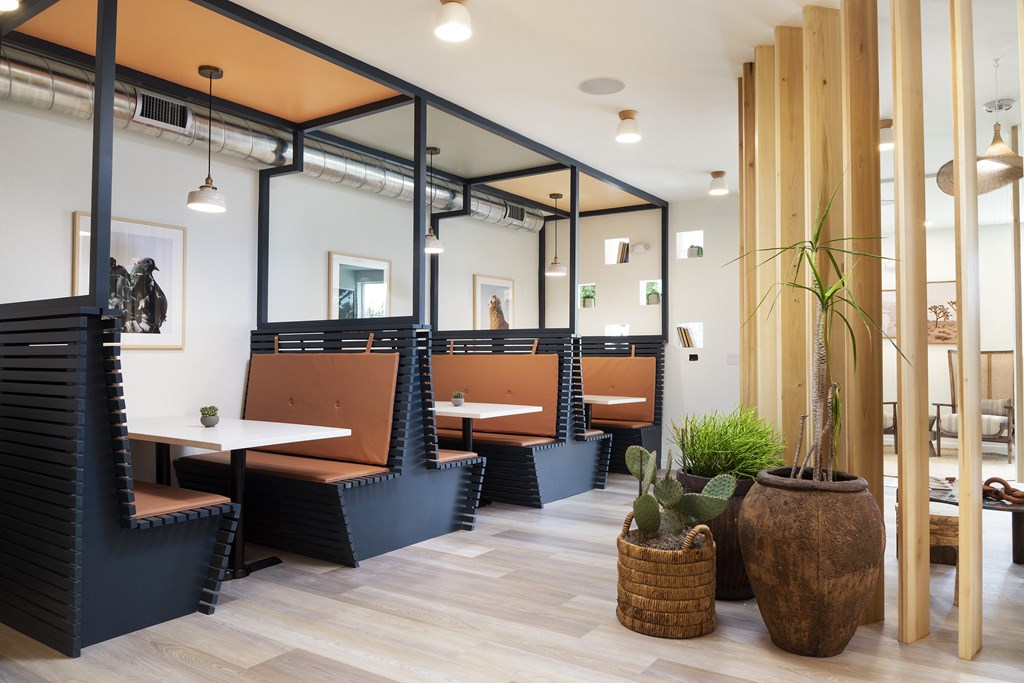 A modern cafe with wooden tables and chairs. at The Reserve La Mirada, La Mirada, California