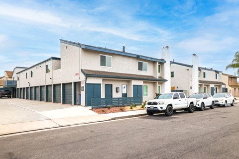 a building with a row of cars parked in front of it