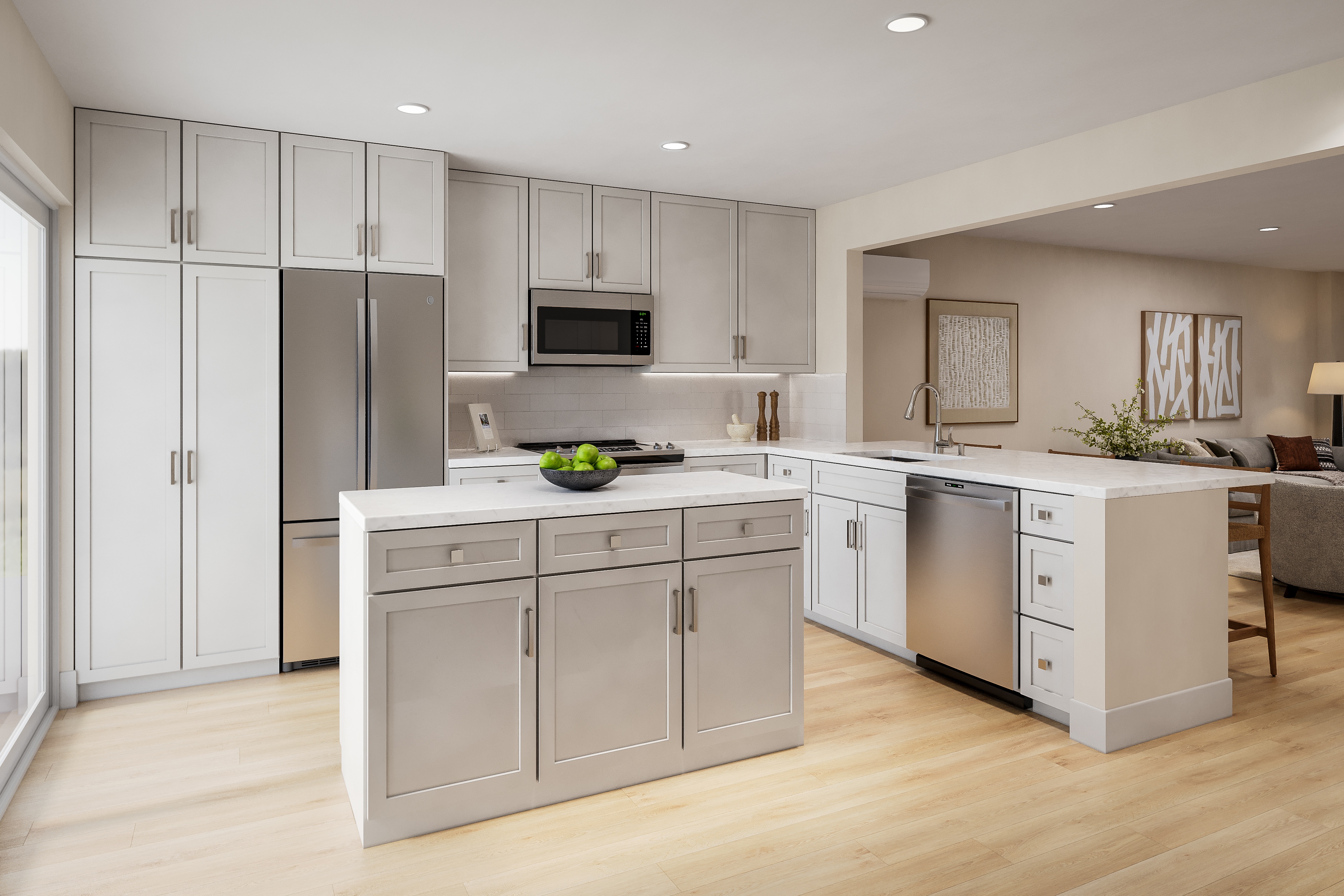 A modern kitchen with a refrigerator, microwave, oven, and sink.