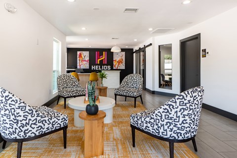 A living room with a patterned chair and a coffee table.