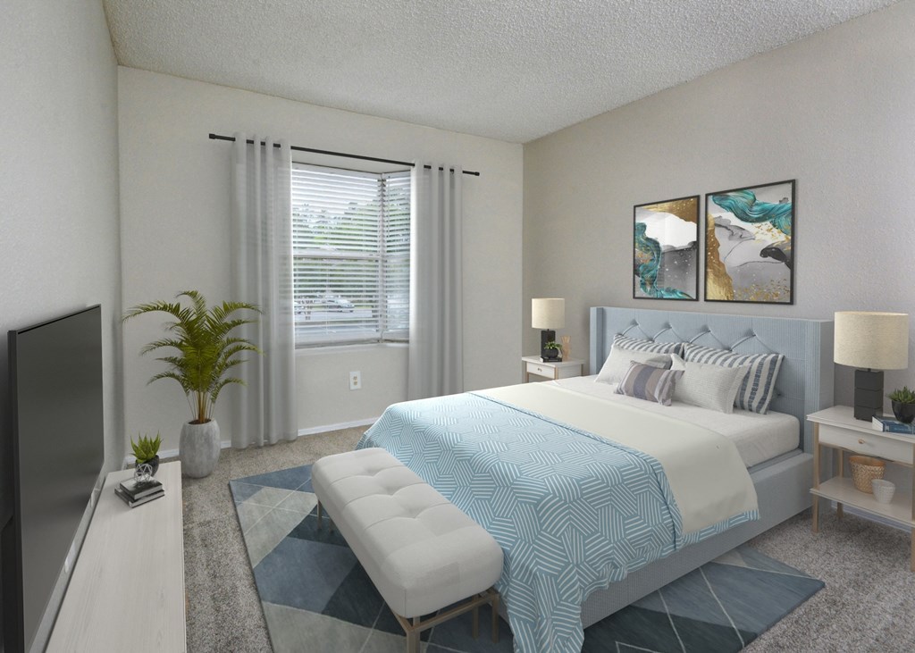 a bedroom with a large bed and a tv