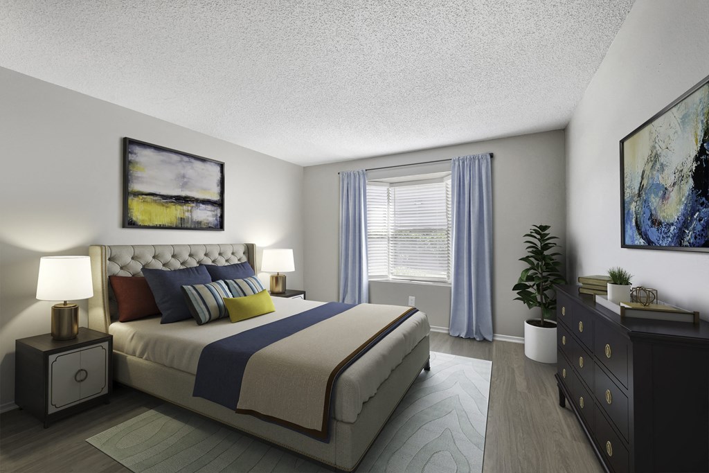 a bedroom with a bed and a dresser and a window