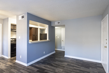 A room with a window and a door.