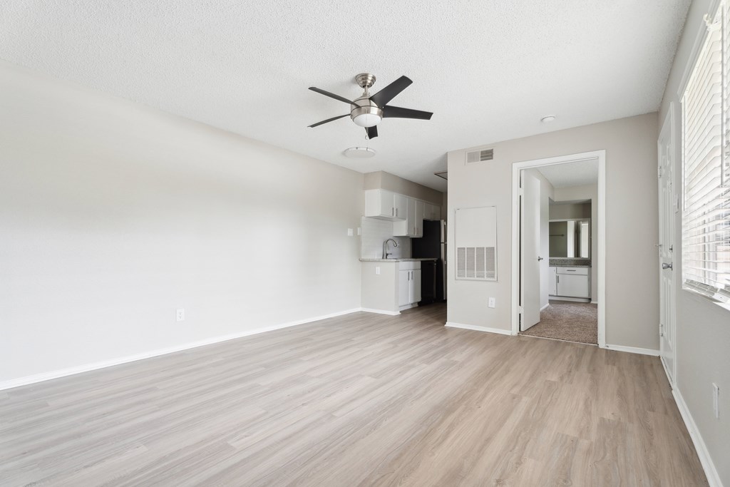 A room with a ceiling fan and light fixture. at Anson at North Hills, Raleigh, NC