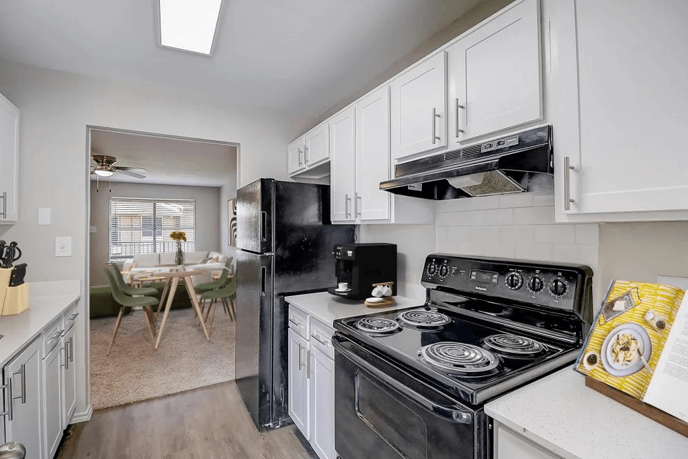 a kitchen with a stove and a refrigerator