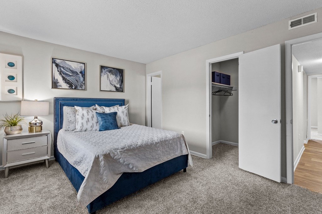 bedroom with a bed and closet at Rosen at North Hills, Raleigh, NC
