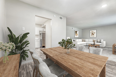 A dining room with a wooden table and chairs.