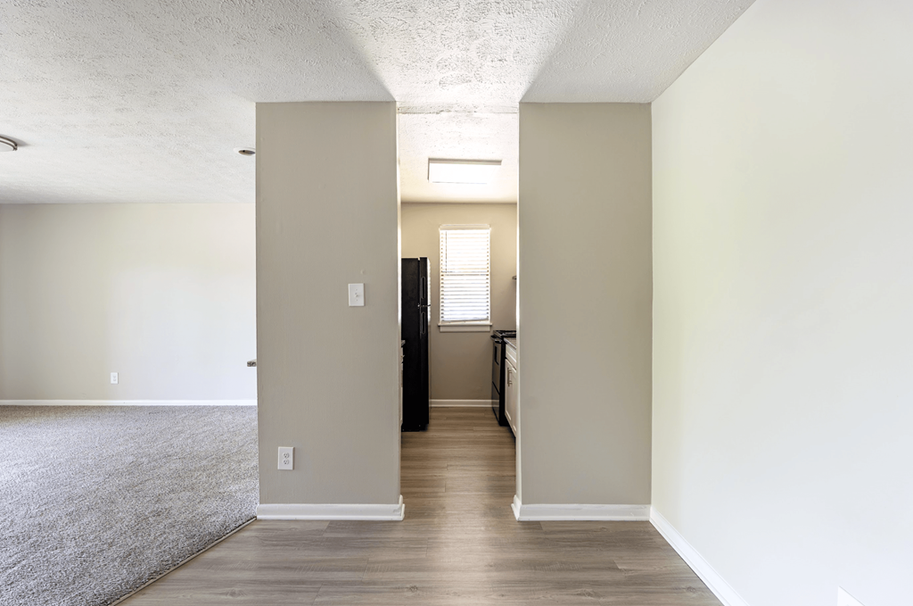 A room with a doorway leading to another room. at The Hudson, North Carolina