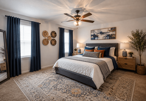 Spacious bedroom with ceiling fan and natural light at Woodway Gardens Townhomes Apartments, Houston, TX 77063