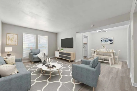 Open concept living and dining room with contemporary decor at North Creek Apartments, Dallas, TX