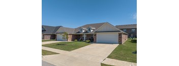 A house with a garage and a driveway.