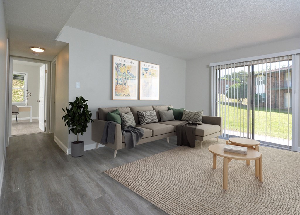 an open living room with a couch and a table