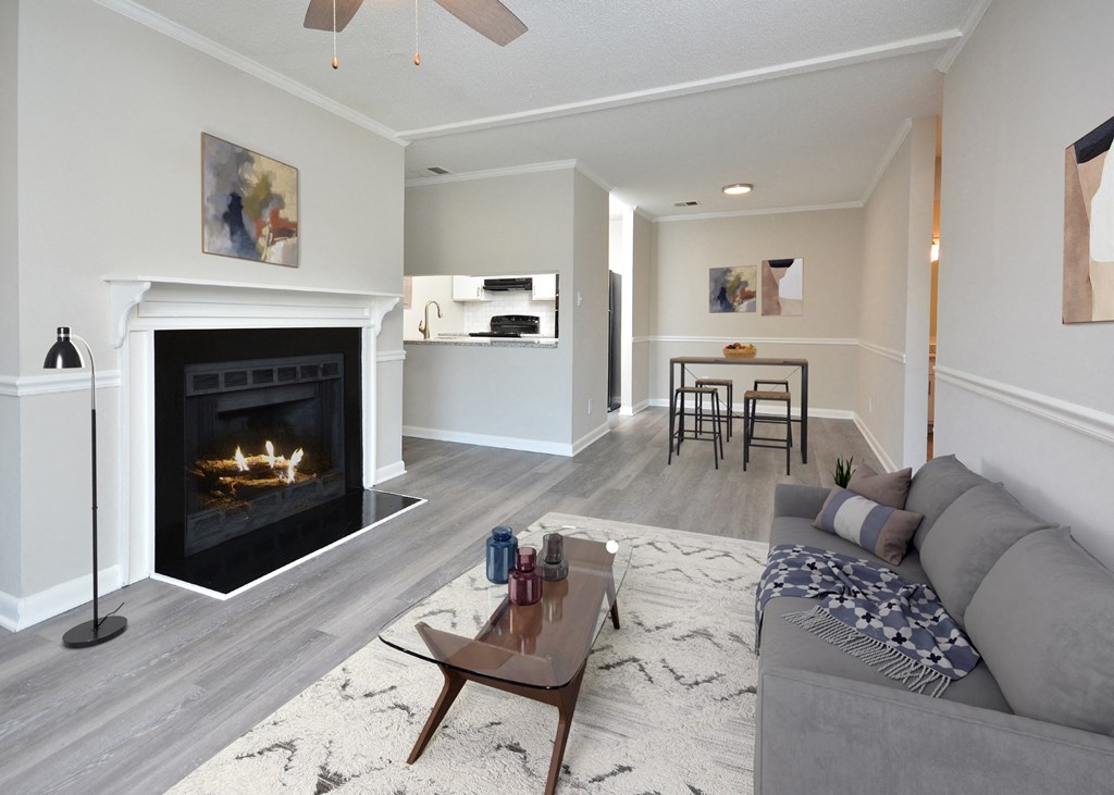 a living room with a fireplace and a couch