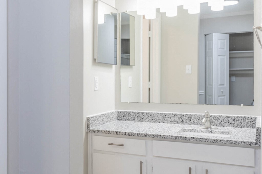 a bathroom with a sink and a mirror  at Henley, North Carolina