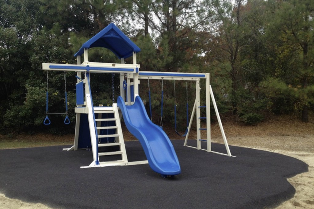 a swing set with a blue slide in a park  at Henley, North Carolina, 28311