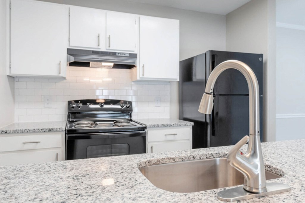 a kitchen with granite counter tops and a sink  at Henley, North Carolina